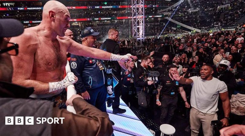 Promoters discussing the Joshua Fury fight in a professional setting.