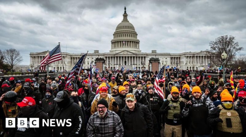 Professionals discussing Capitol riot convictions in a courtroom.