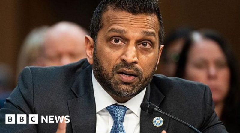 A business meeting discussing the Kash Patel lawsuit against The Atlantic.