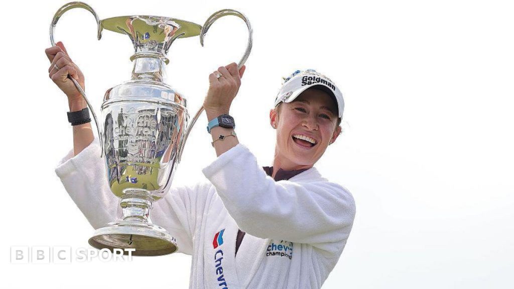 Nelly Korda celebrating her Chevron Championship victory on the golf course.
