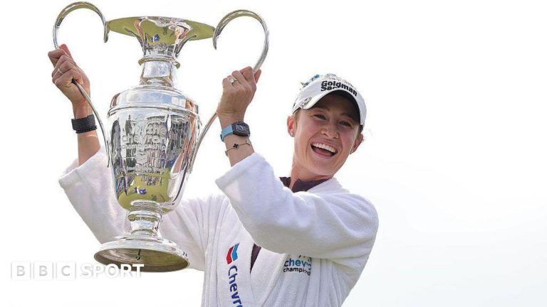 Nelly Korda celebrating her Chevron Championship victory on the golf course.