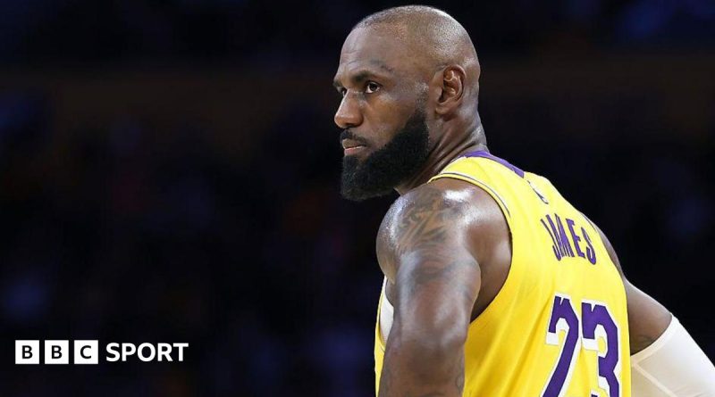 Lakers players showing teamwork during an NBA playoffs victory.