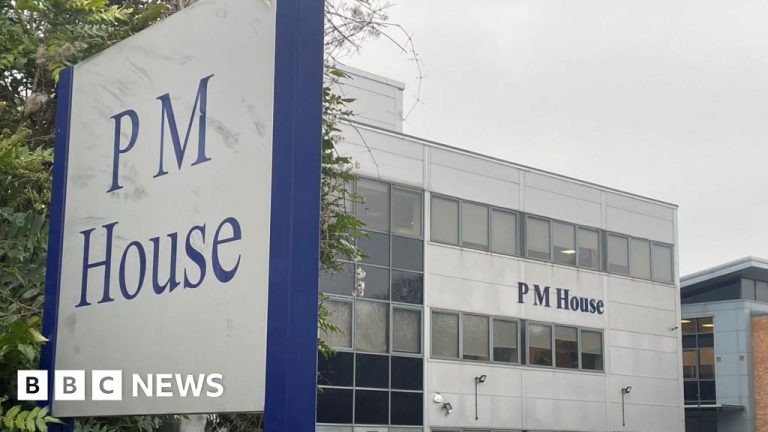 Professionals discussing serious issues related to a fraud investigation in a modern office.