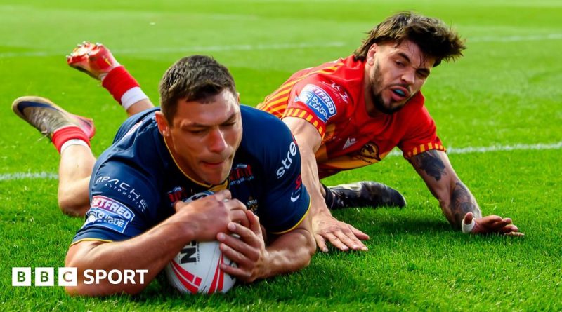 Leeds Rhinos players in action during a Super League victory.