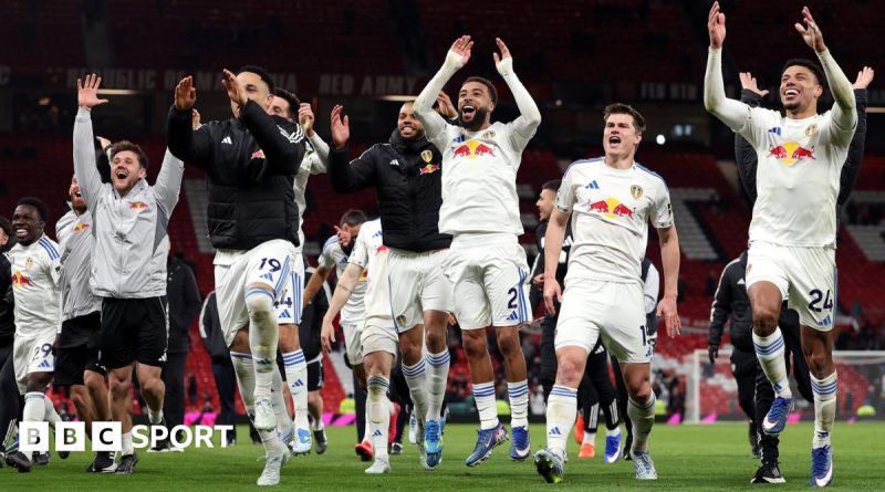 Leeds United players celebrating victory, highlighting their Premier League survival hopes.