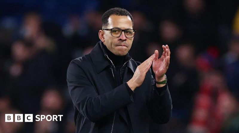 A football coaching meeting discussing strategies, focusing on Liam Rosenior Chelsea.