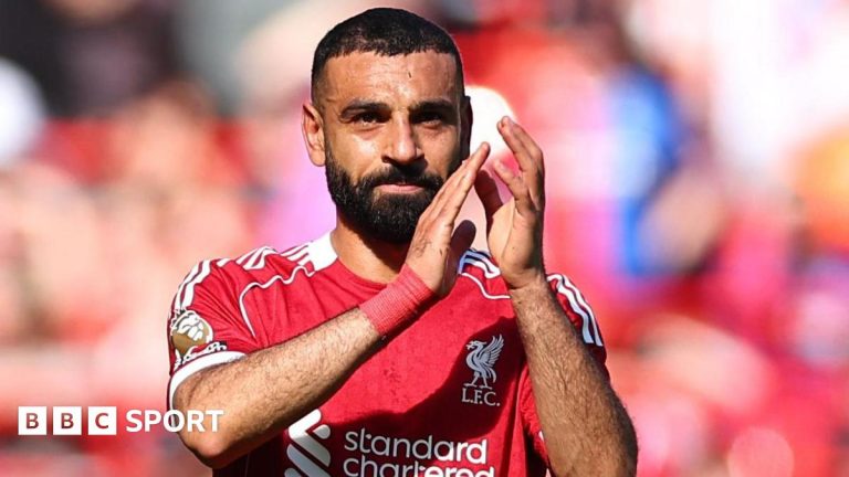 Liverpool medical team discusses Salah injury update in training room.