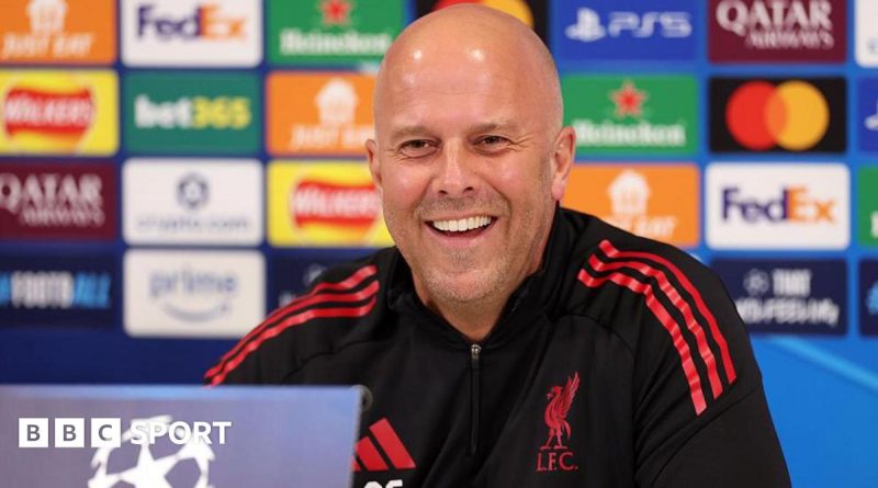 Liverpool team discussing strategies for PSG Champions League comeback.