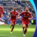 Liverpool players celebrating a goal during their derby victory against Everton.