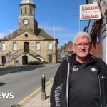 Business owners discussing the Sanquhar highway closure impact on local economy.