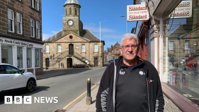 Business owners discussing the Sanquhar highway closure impact on local economy.