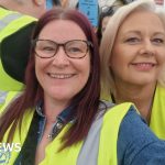 A diverse group of professionals discussing plans for communities to buy homes.