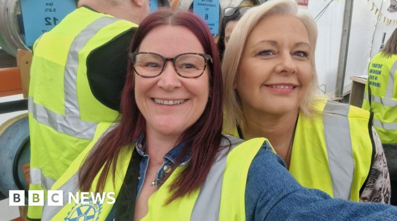 A diverse group of professionals discussing plans for communities to buy homes.