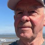 Professionals discussing the artificial grass ban and its environmental impact.