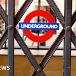 Crowd of commuters at a London Tube station during the strike.