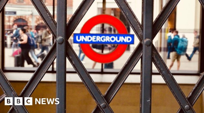 Crowd of commuters at a London Tube station during the strike.