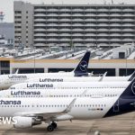 Travelers at airport during summer, highlighting Lufthansa summer flights.