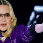 Madonna Coachella performance with musicians and audience enjoying the show.