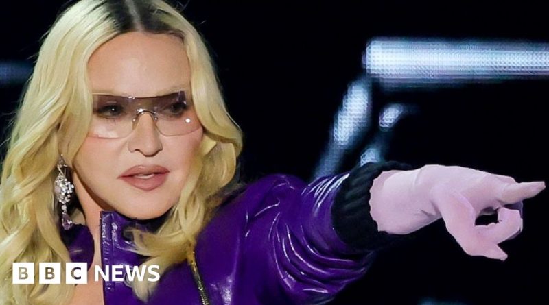 Madonna Coachella performance with musicians and audience enjoying the show.