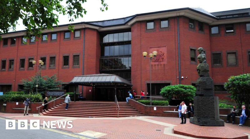 Courtroom scene depicting professionals discussing evidence related to the rape of Sikh woman.