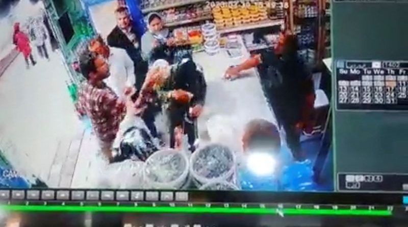 A serious discussion about the yogurt incident in Iran among professionals in a store.