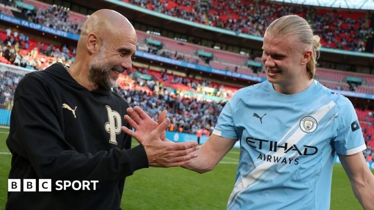Manchester City treble quest celebrated by players on field.