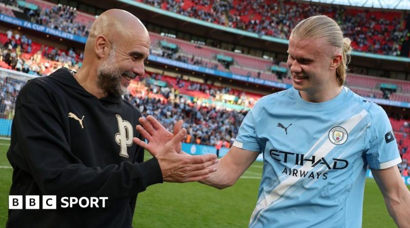 Manchester City treble quest celebrated by players on field.