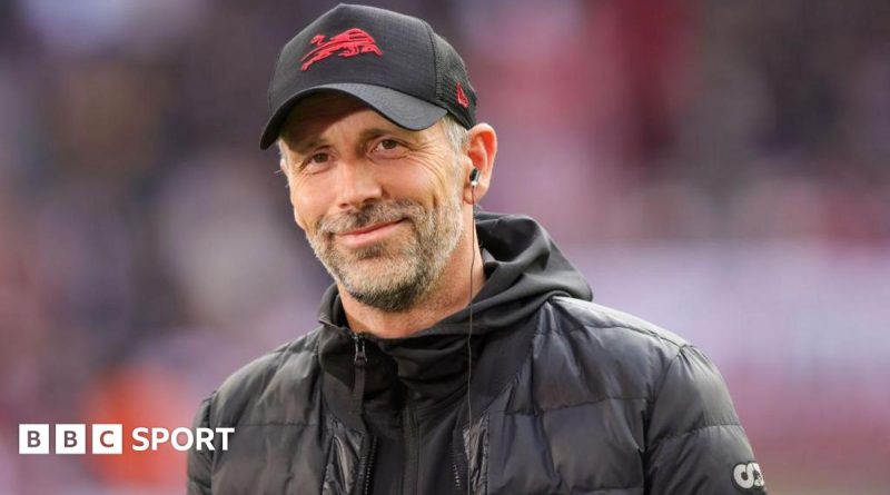 A group of coaches discussing strategies for the Bournemouth manager transition.