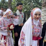 Mass wedding in Gaza with 300 couples celebrating love and unity.