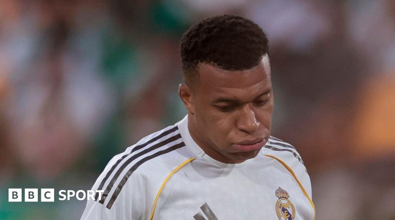 Kylian Mbappe injury news with football players practicing together.