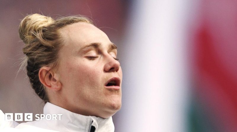 Meg Jones rugby captain leading her team on the field during a match.