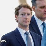 A group of professionals discussing Meta job cuts and AI investment strategies.