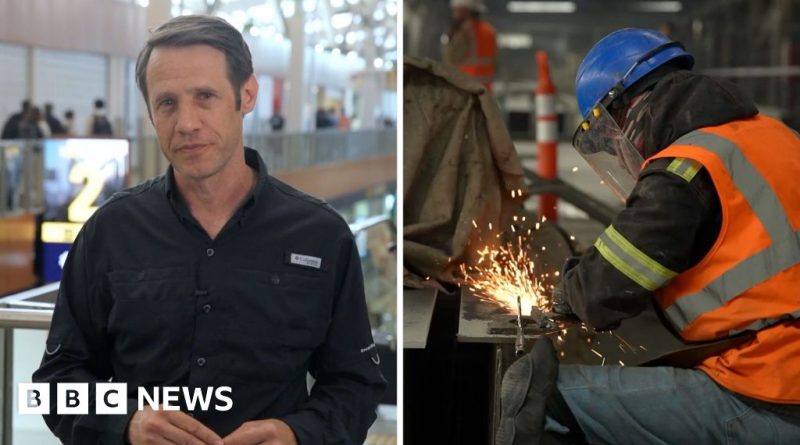 A busy Mexico City airport scene showing renovations and travelers during preparations for the World Cup.