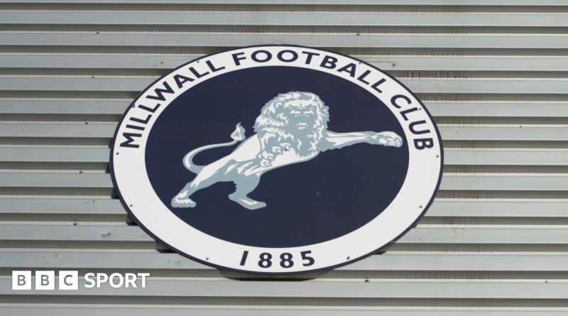Millwall FC legal action discussion with professionals in a boardroom.
