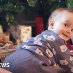 A happy toddler playing with toys, representing a blood transfusion saves baby story.