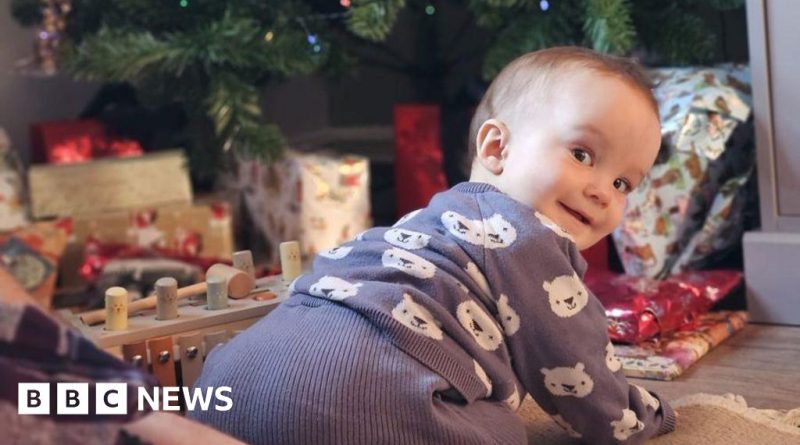 A happy toddler playing with toys, representing a blood transfusion saves baby story.