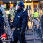 A meeting of professionals discussing misinformation and public outrage.