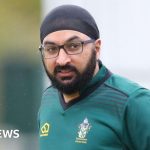 Monty Panesar participating in local cricket team activities with players.
