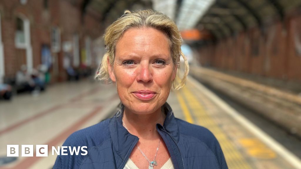 A group of women discussing lobular breast cancer research in an office.