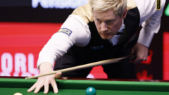 Neil Robertson in a World Championship snooker match at Crucible Theatre.