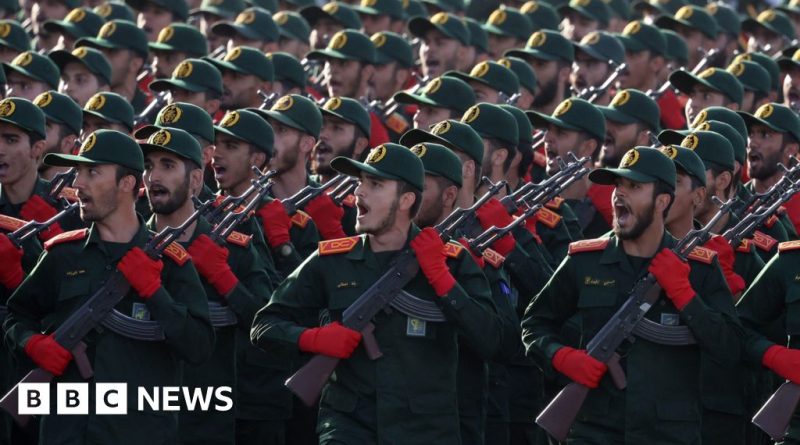 Professionals discussing state-backed terror groups in a meeting setting.
