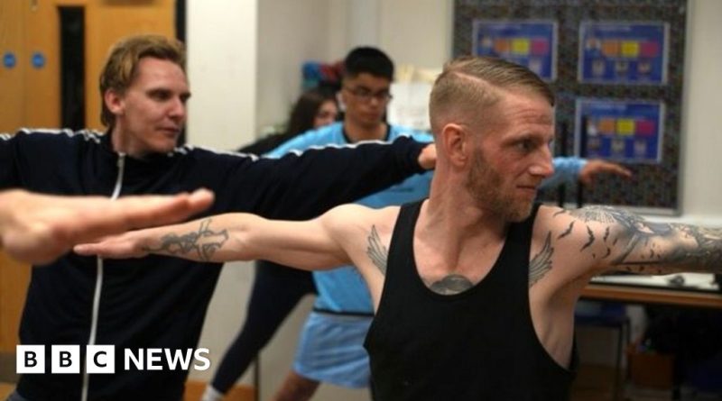 Men's group meeting to reduce NHS strain through community support.