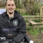 Community members discuss accessible pathway issues near steep steps.