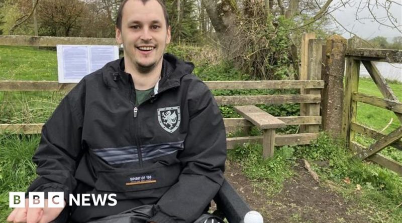 Community members discuss accessible pathway issues near steep steps.