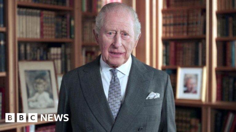 Visitors admire the new Queen Elizabeth statue during its unveiling ceremony.
