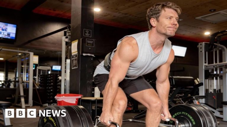 Group of men discussing male beauty standards and masculinity in a modern office.