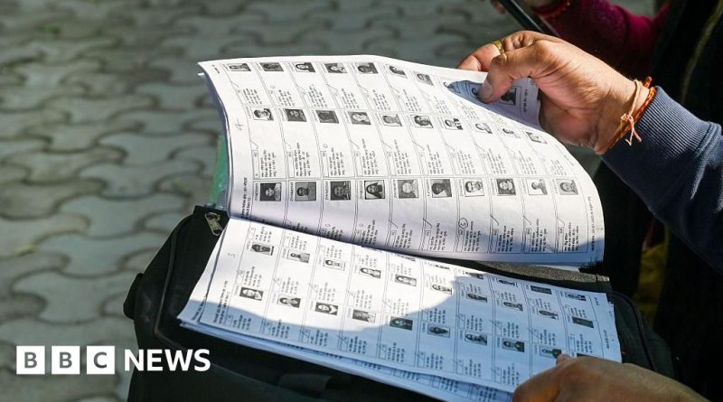 Officials discussing West Bengal voter rights in a formal setting.
