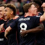 Fans celebrating Nottingham Forest's victory in a thrilling match.