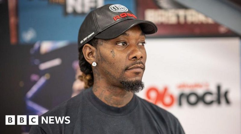 Crowd at a music festival celebrating Offset's performance after shooting.