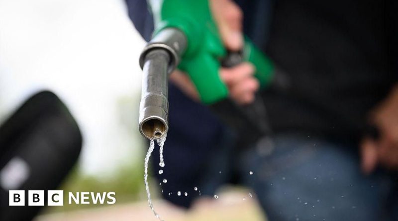 Professionals discussing rising oil prices in a business meeting setting.